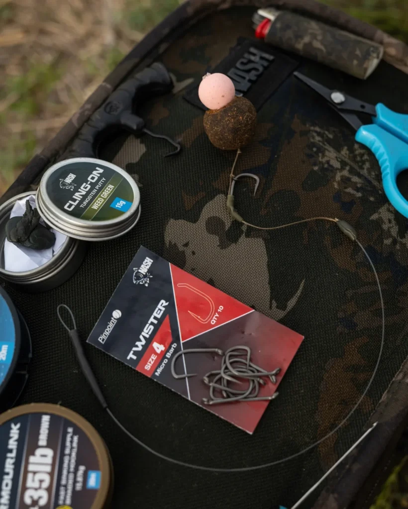 Combi rig laid out with hookbait, hooks, scissors, and putty.
